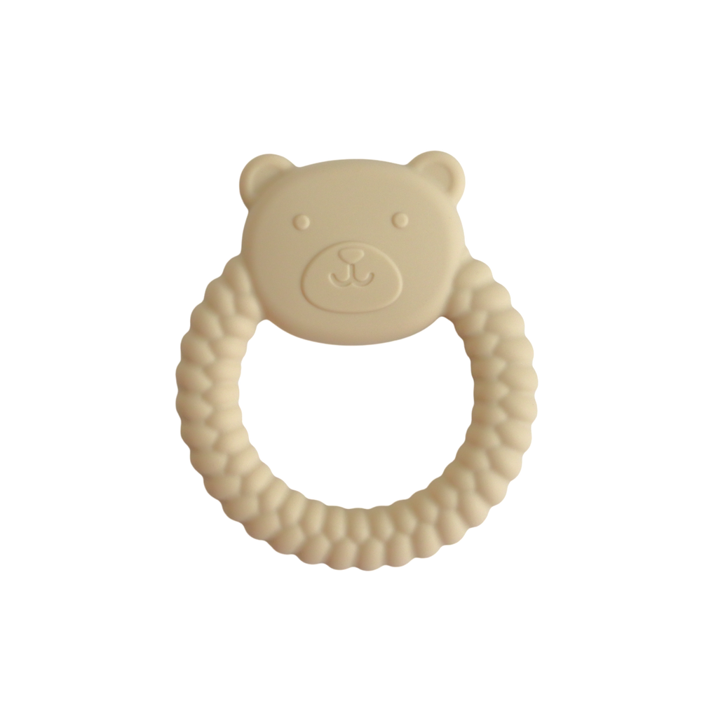Beige bear-shaped teething ring on a white background