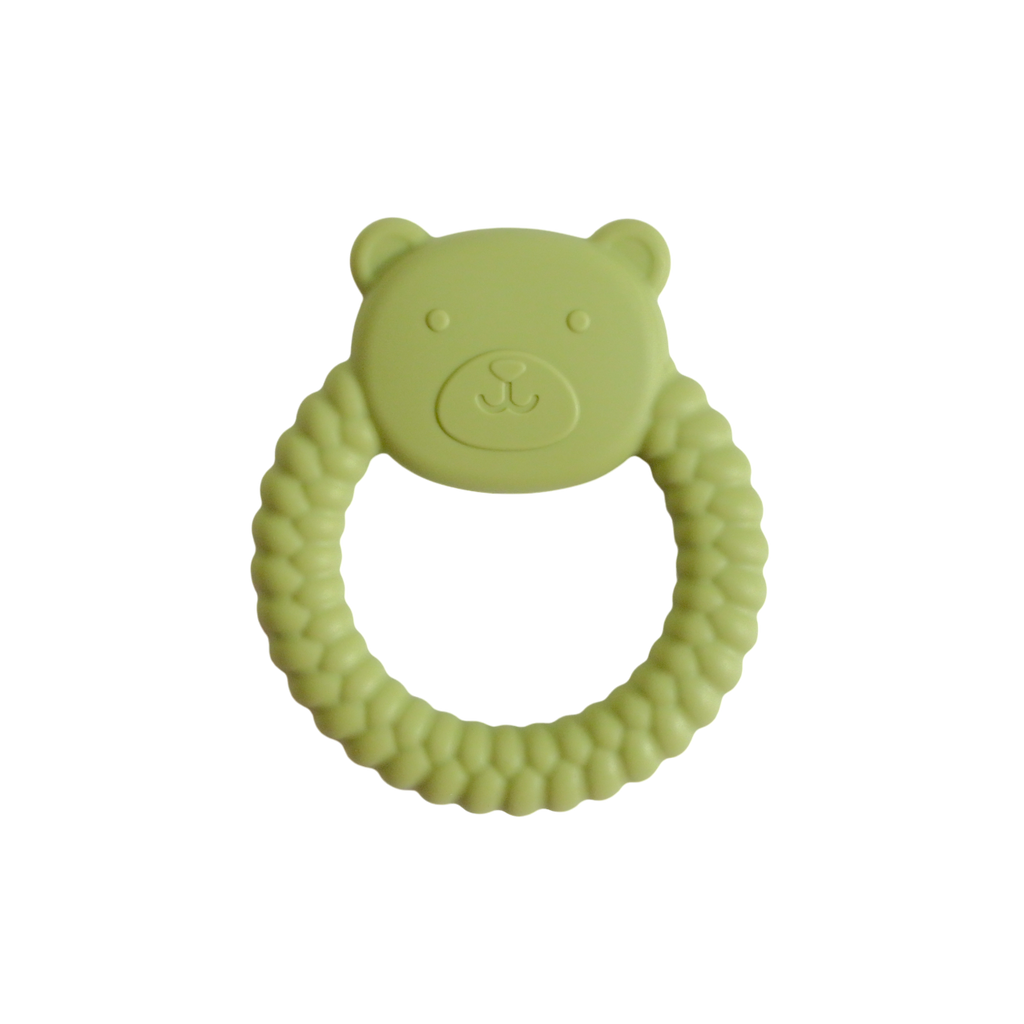 Green bear-shaped teething ring on a white background