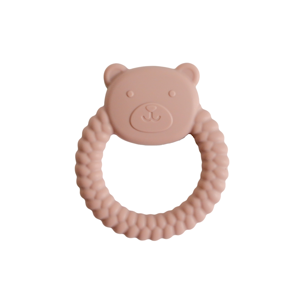Pink bear-shaped teething ring on a white background