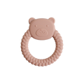 Pink bear-shaped teething ring on a white background
